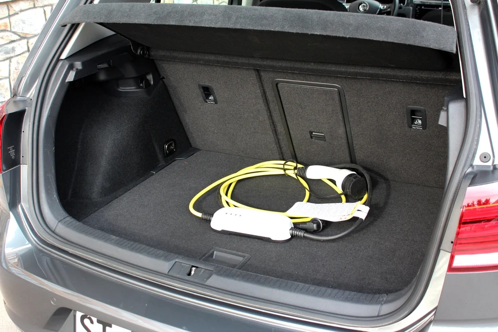 cables and plugs in the trunk of a car