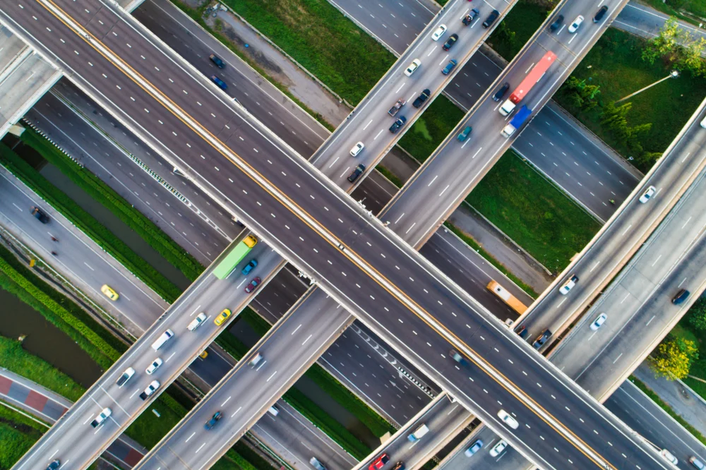 An aerial view of numerous intersecting highway overpasses.