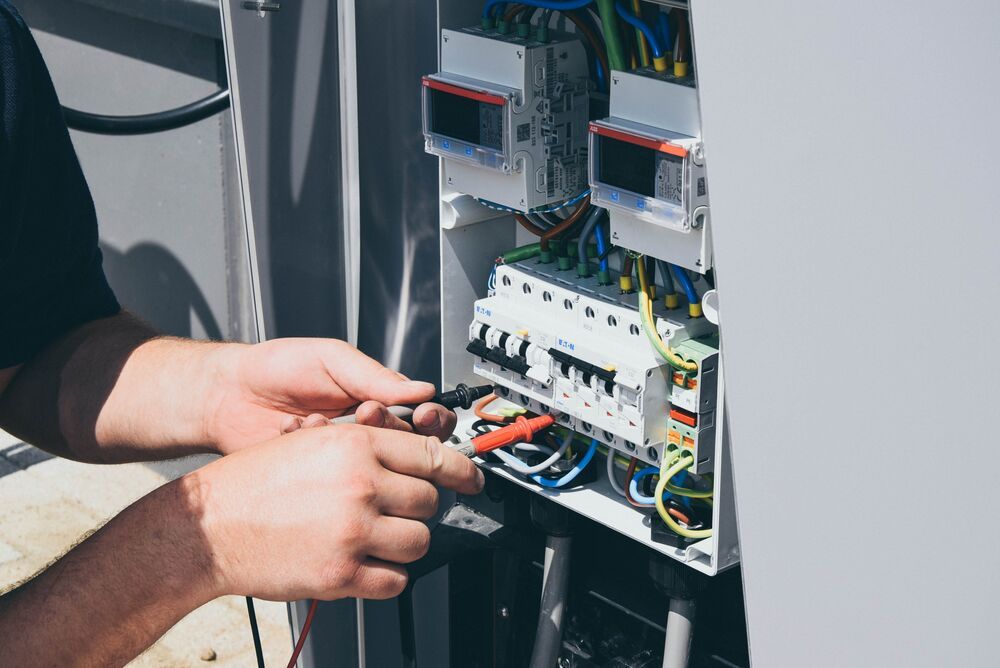 a technician is connecting cables.