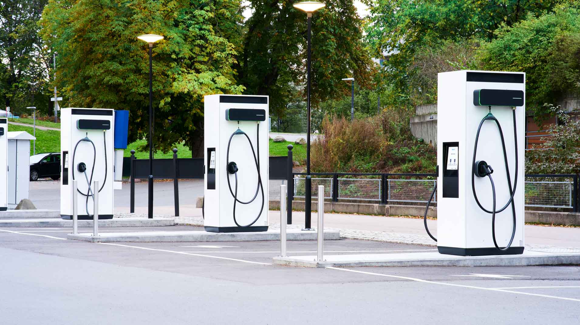 3 EVBox Troniq Modular fast charging stations in a carpark during the day