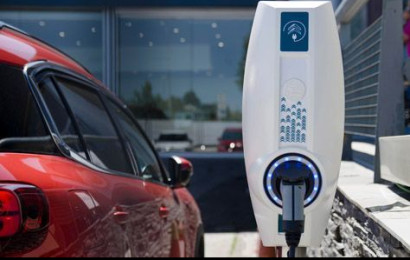 electric car charging station next to electric car
