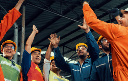 A group of engineers doing a group high five